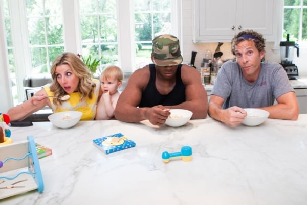 Jesse Itzler with his wife (Sara Blakely), SEAL and son sitting at the counter, credit is Deana Levine.   Living with a Seal.